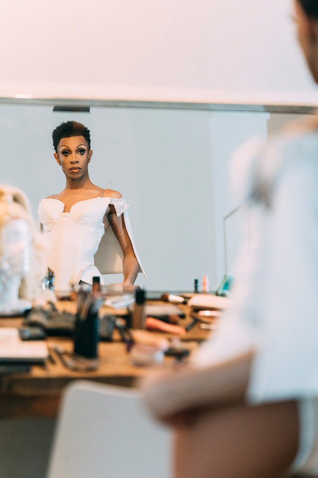 Drag queen looking into the mirror