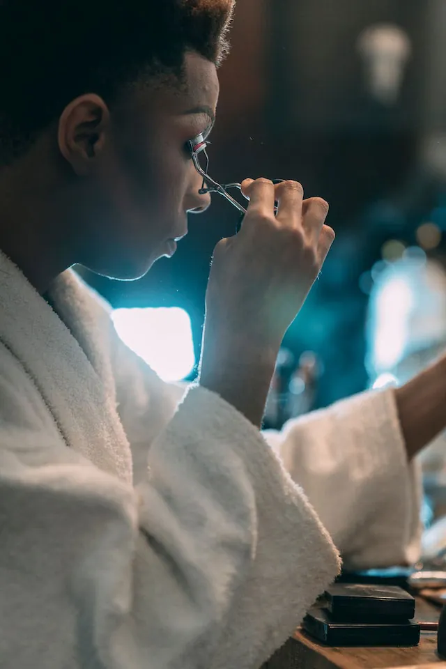 Drag queen applying makeup for transformation